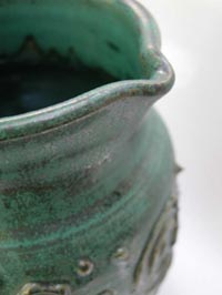 Detail of green pitcher